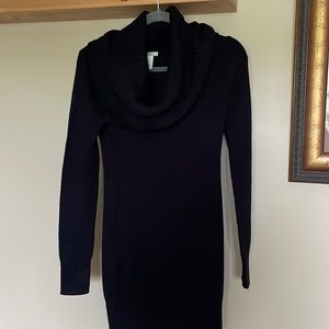 Black cowl neck, sweater dress with ribbing on the bottom